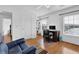 Bright home office with hardwood floors, a work desk, and a comfortable chair at 7027 Walham Grv, Duluth, GA 30097