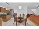 Bright kitchen features stainless appliances, wooden cabinetry and a round dining table, perfect for enjoying meals at 7027 Walham Grv, Duluth, GA 30097