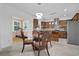 Open kitchen and breakfast nook with modern stainless steel appliances and an island at 7027 Walham Grv, Duluth, GA 30097