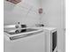 Well-equipped laundry room featuring a washer and dryer set at 7027 Walham Grv, Duluth, GA 30097