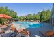 Community pool with plenty of chairs and lounge seating at 7027 Walham Grv, Duluth, GA 30097