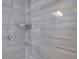 Beautiful shower featuring stone-look tile and a chrome shower fixture at 7027 Walham Grv, Duluth, GA 30097