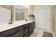 Bathroom with double sink vanity, framed mirror and walk-in shower at 110 Collingwood Lndg, Covington, GA 30016
