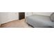 Bedroom showcasing gray bedding and carpet, along with a dresser at 110 Collingwood Lndg, Covington, GA 30016