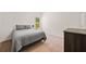 Minimalist bedroom with neutral colored walls, carpet, bed and dresser at 110 Collingwood Lndg, Covington, GA 30016