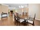 Spacious dining room featuring hardwood floors, a modern chandelier, and open-concept design at 110 Collingwood Lndg, Covington, GA 30016