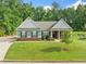 Charming single-story home with well-manicured lawn and inviting entryway at 110 Collingwood Lndg, Covington, GA 30016