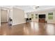 Bright and airy living room boasts hardwood floors and seamless flow to the kitchen bar at 110 Collingwood Lndg, Covington, GA 30016