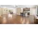 Expansive living area with bar seating, hardwood floors, and easy access to dining area at 110 Collingwood Lndg, Covington, GA 30016