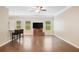 Spacious living room featuring hardwood floors, ample natural light, and modern decor at 110 Collingwood Lndg, Covington, GA 30016