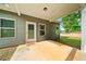 Outdoor patio featuring a concrete base, siding, and a door at 110 Collingwood Lndg, Covington, GA 30016