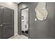 Hallway view into a modern bathroom with a vanity and decorative mirror at 1766 Ware Ave, Atlanta, GA 30344