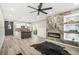 Open-concept living room featuring a modern fireplace, sleek kitchen, and contemporary design at 1766 Ware Ave, Atlanta, GA 30344