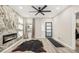 Stylish living room with a modern fireplace feature and a multi-light front door at 1766 Ware Ave, Atlanta, GA 30344