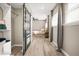 Cozy main bedroom with wood-look floors, closet, ceiling fan and lots of natural light at 1766 Ware Ave, Atlanta, GA 30344