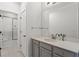 Bathroom featuring modern vanity, a large mirror, and a shower with a glass door at 205 Maplewood Dr, Roswell, GA 30075