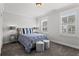 Carpeted bedroom with bright, natural light, soft gray walls, and plantation shutters at 205 Maplewood Dr, Roswell, GA 30075