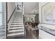 Elegant foyer features staircase with hardwood floors and decorative lighting at 205 Maplewood Dr, Roswell, GA 30075