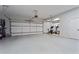 Spacious garage with plenty of room for parking and storage, plus fitness equipment at 205 Maplewood Dr, Roswell, GA 30075