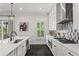 Bright, modern kitchen with white cabinetry and stainless steel appliances at 205 Maplewood Dr, Roswell, GA 30075