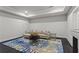 Cozy living room with modern decor, stylish rug, and recessed lighting at 205 Maplewood Dr, Roswell, GA 30075