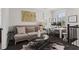 Well lit, neutral colored living room with lots of bright, natural light and comfortable furniture at 205 Maplewood Dr, Roswell, GA 30075