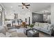 Contemporary open-concept living room with neutral decor, bright lighting, and dining area at 205 Maplewood Dr, Roswell, GA 30075