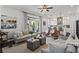 Open-concept living room and kitchen with modern furnishings, decor, and lots of natural light at 205 Maplewood Dr, Roswell, GA 30075