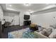 Relaxing living room featuring modern furnishings, a large television, and stylish decor at 205 Maplewood Dr, Roswell, GA 30075