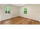 Bright bedroom with hardwood floors, neutral walls, and views of the surrounding trees at 381 Warner Se St, Marietta, GA 30060