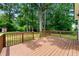 Well-maintained deck with brown railings overlooking green lawn and mature trees at 381 Warner Se St, Marietta, GA 30060