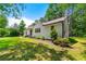Well-maintained home exterior with green lawn and mature trees at 381 Warner Se St, Marietta, GA 30060