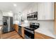 Updated kitchen with stainless steel appliances, quartz countertops, and ample storage space at 381 Warner Se St, Marietta, GA 30060