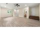 Open living space with a ceiling fan, tile floors, and views into the bathroom at 381 Warner Se St, Marietta, GA 30060