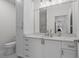 Bathroom featuring marble countertops, modern fixtures, and ample storage space at 401 16Th Nw St # 1357, Atlanta, GA 30363