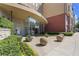 Elegant entrance with stone accents, glass doors, and decorative landscaping at 401 16Th Nw St # 1357, Atlanta, GA 30363