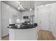 Modern kitchen with stainless steel appliances and a breakfast bar at 401 16Th Nw St # 1357, Atlanta, GA 30363