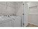 Laundry room featuring a washer, dryer, and storage area at 401 16Th Nw St # 1357, Atlanta, GA 30363