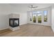 Living room showcasing fireplace, wood-look flooring, and bright natural light at 401 16Th Nw St # 1357, Atlanta, GA 30363