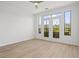 Bright living room featuring wood-look flooring and access to the outdoors through large glass doors at 401 16Th Nw St # 1357, Atlanta, GA 30363