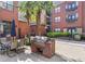Outdoor brick grill with seating surrounded by lush greenery at 401 16Th Nw St # 1357, Atlanta, GA 30363