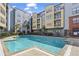 Apartment complex with a well-maintained outdoor pool surrounded by lounge chairs at 401 16Th Nw St # 1357, Atlanta, GA 30363