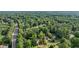 An aerial view highlighting the neighborhood, lush greenery, and the surrounding mature trees at 4363 Old Mabry Road Northeast Ne Rd, Roswell, GA 30075