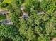 An aerial view of the home surrounded by lush trees in a tranquil and private setting at 4363 Old Mabry Road Northeast Ne Rd, Roswell, GA 30075