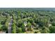 This neighborhood image showcases lush trees surrounding quaint houses in a quiet locale at 4363 Old Mabry Road Northeast Ne Rd, Roswell, GA 30075