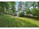 A sprawling backyard complete with firepit, well-maintained lawn, and inviting patio with gazebo at 4363 Old Mabry Road Northeast Ne Rd, Roswell, GA 30075