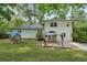 A large backyard with a small playhouse, gazebo, and a well-maintained lawn for outdoor enjoyment at 4363 Old Mabry Road Northeast Ne Rd, Roswell, GA 30075
