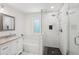 Bright bathroom featuring tiled shower and granite countertop vanity at 4363 Old Mabry Road Northeast Ne Rd, Roswell, GA 30075