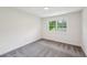 Bright bedroom with plush gray carpet and a large window offering natural light at 4363 Old Mabry Road Northeast Ne Rd, Roswell, GA 30075