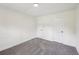 Minimalist bedroom with plush carpet, two closets, and neutral tones throughout at 4363 Old Mabry Road Northeast Ne Rd, Roswell, GA 30075